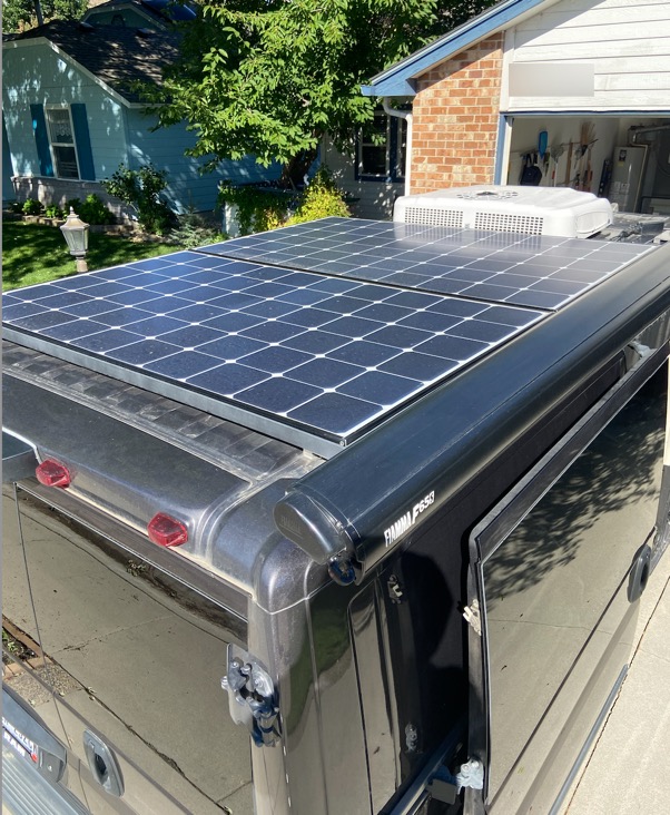 Rooftop solar panels and Fiamma awning